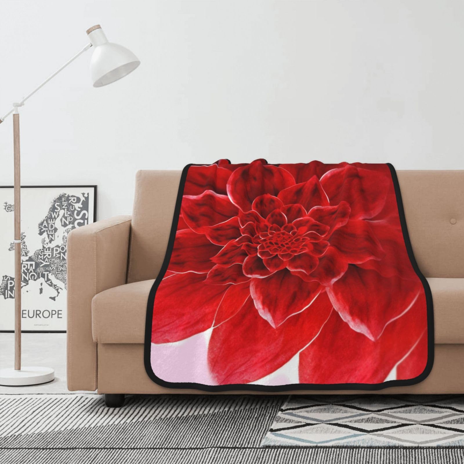 Couverture polaire fleur rouge légère pour vos soirées cocooning sur le canapé