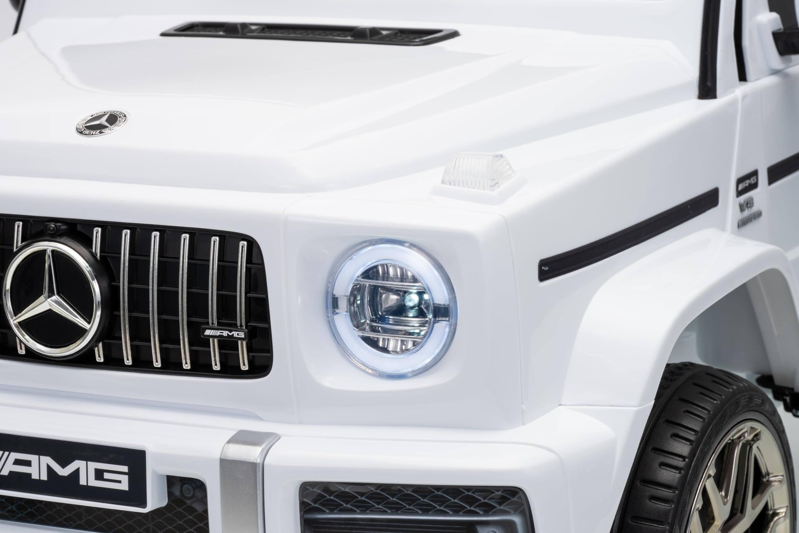 FINOOS Coche Electrico para Niños Mercedes G63 AMG 12V, con 2 Motores, Control Remoto, Bluetooth, Ruedes de Goma, Asiento de Cuero (Blanco)
