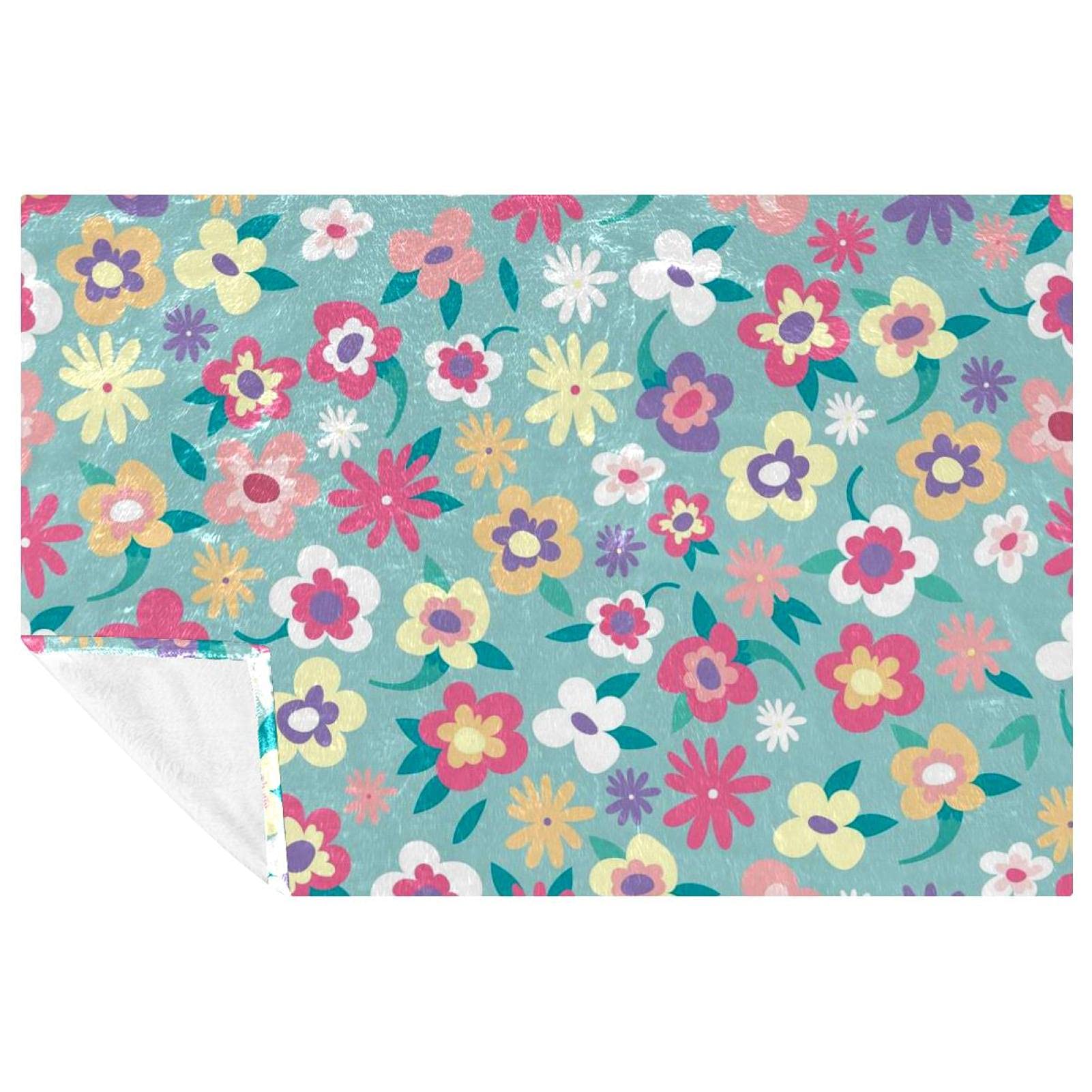 Couverture douce à motif floral pour créer un nid douillet sur votre canapé