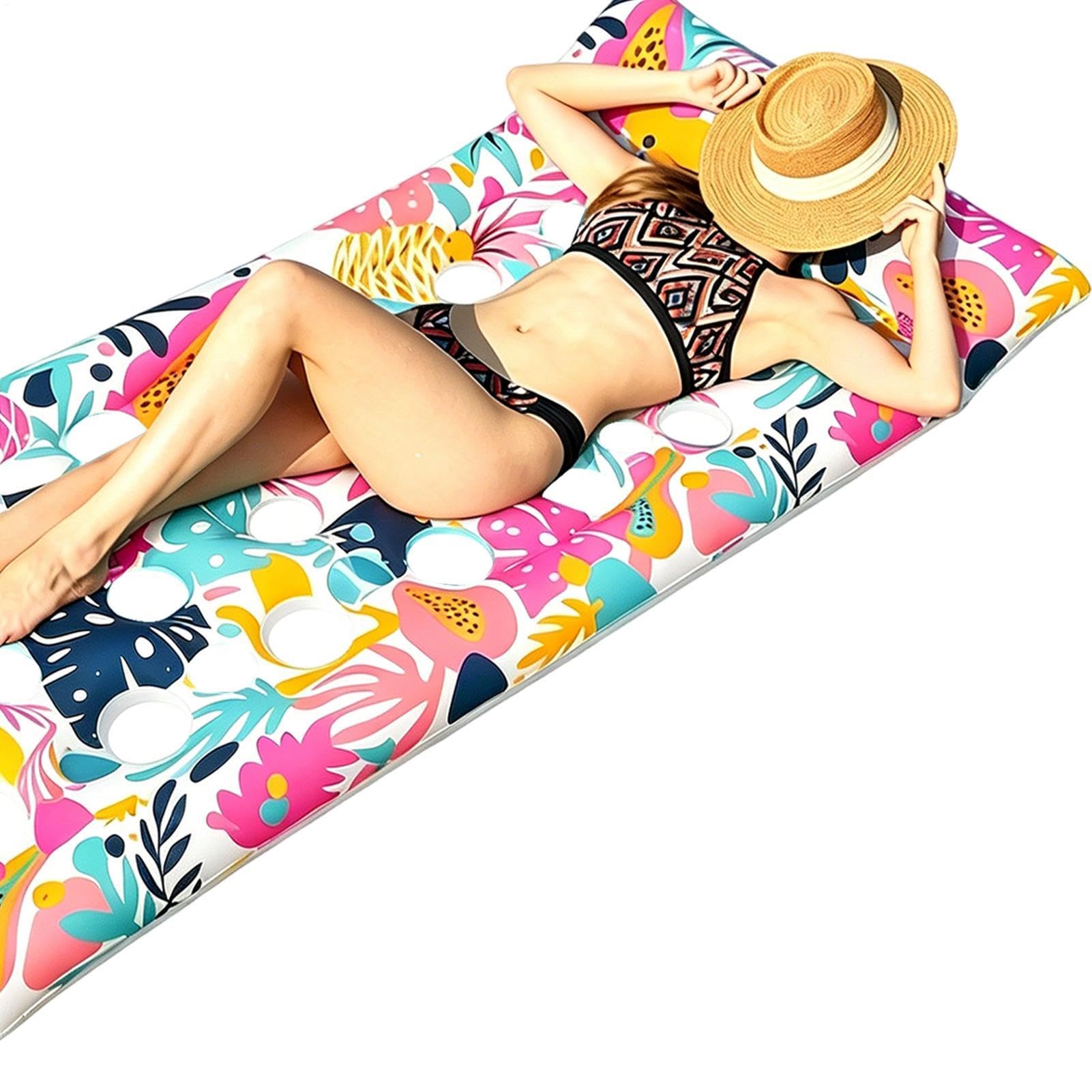 Chaise longue de piscine gonflable avec impression de feuilles tropicales