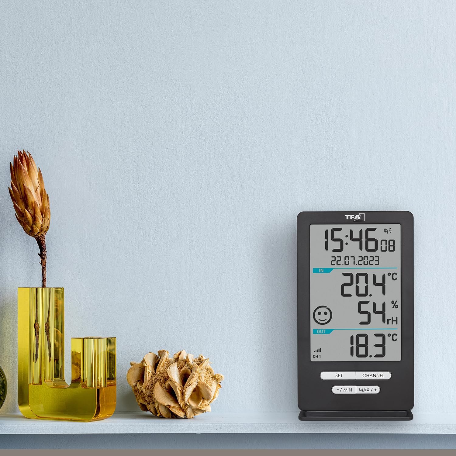 The TFA Dostmann XENA HOME main display unit in a room setting