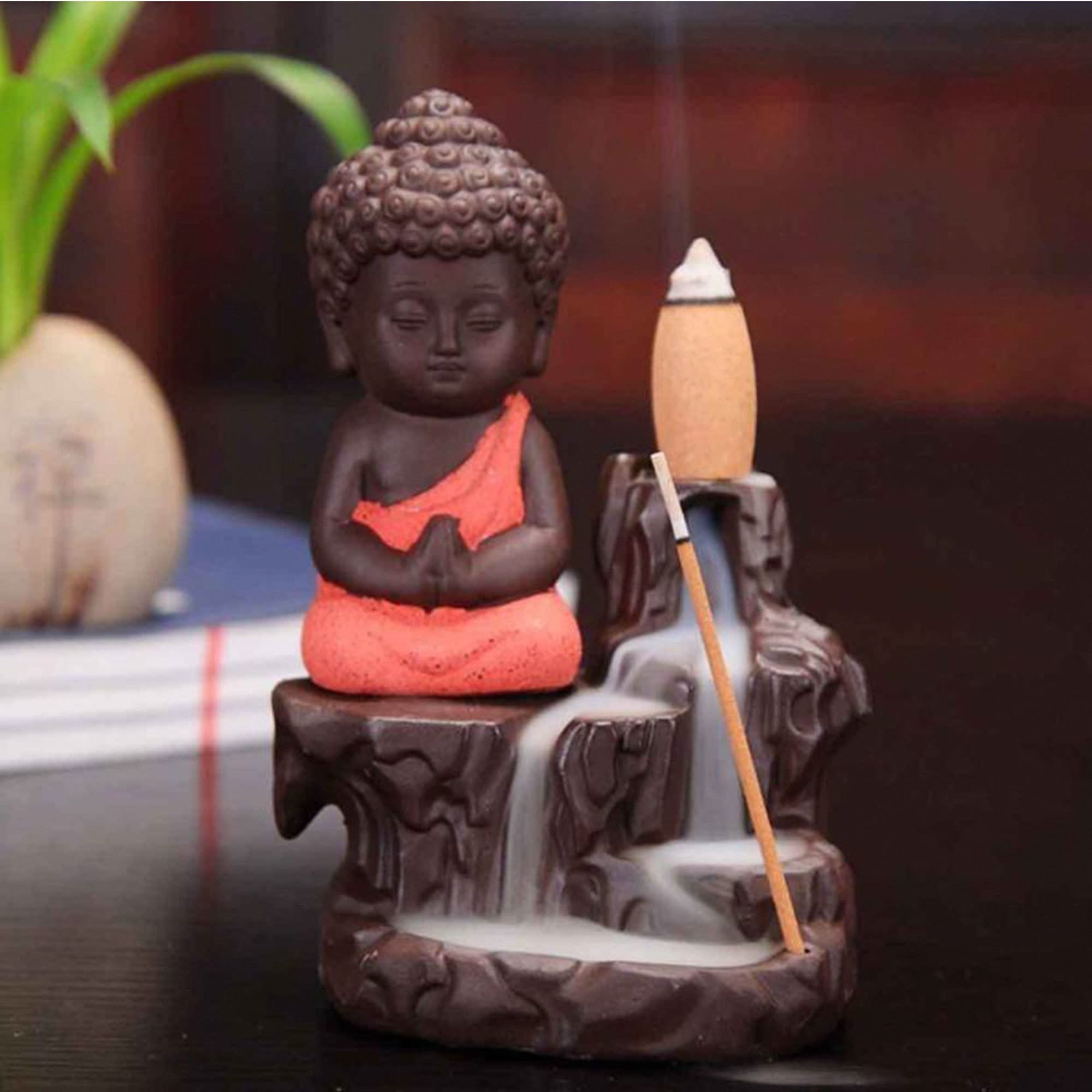 Khushi Enterprise Handcrafted Meditating Little Baby Monk Buddha Smoke Backflow Cone Incense Holder with 10 Incense Cones Decorative Showpiece - 12 cm (Polyresin, Multicolor)