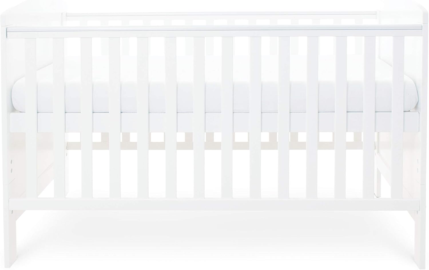 Cot bed with mattress at highest setting