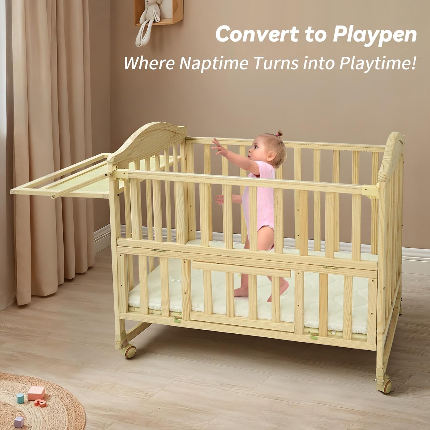 Toddler standing and playing inside the Flwrgirl Mini Baby Crib converted to a playpen
