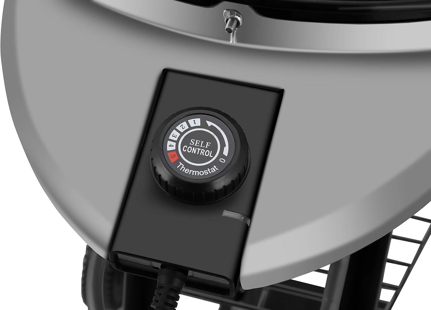 Close-up of the thermostat control dial for the electric barbecue