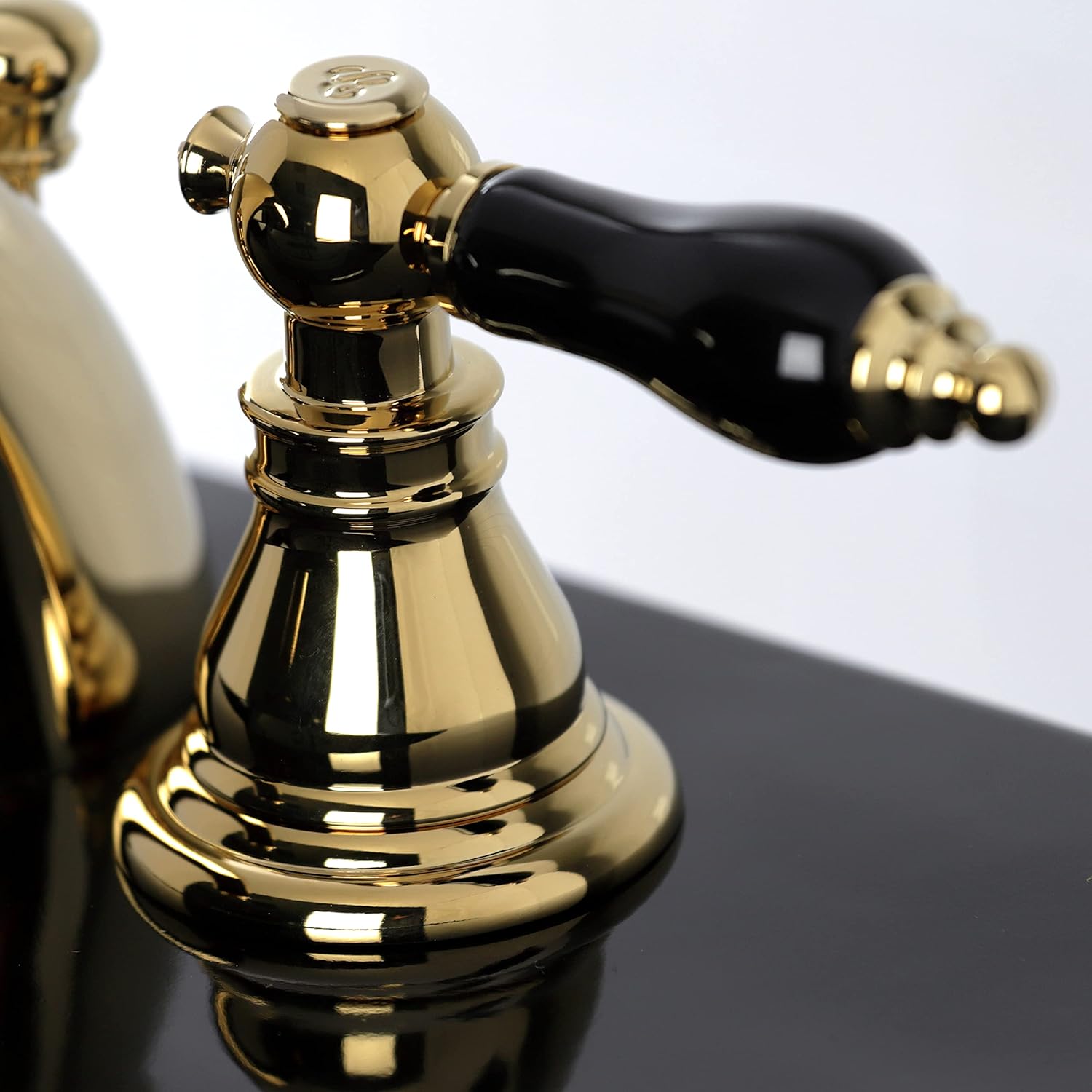 Kingston Brass KB952AKL Duchess Widespread Bathroom Faucet with Plastic Pop-Up, Polished Brass