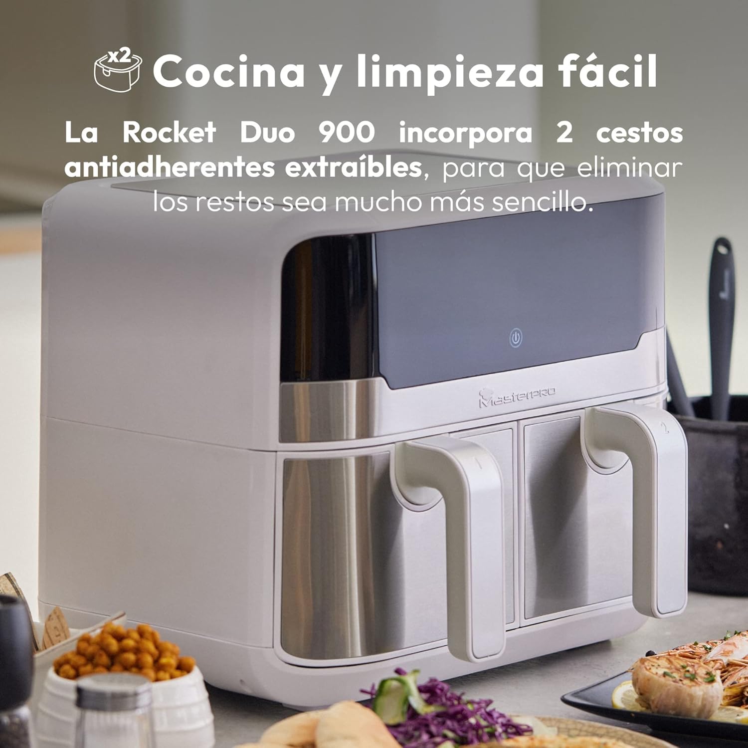 MasterPro Rocket Duo 900 Dual Air Fryer with one basket pulled out, showing its non-stick interior, and a hand holding the handle.