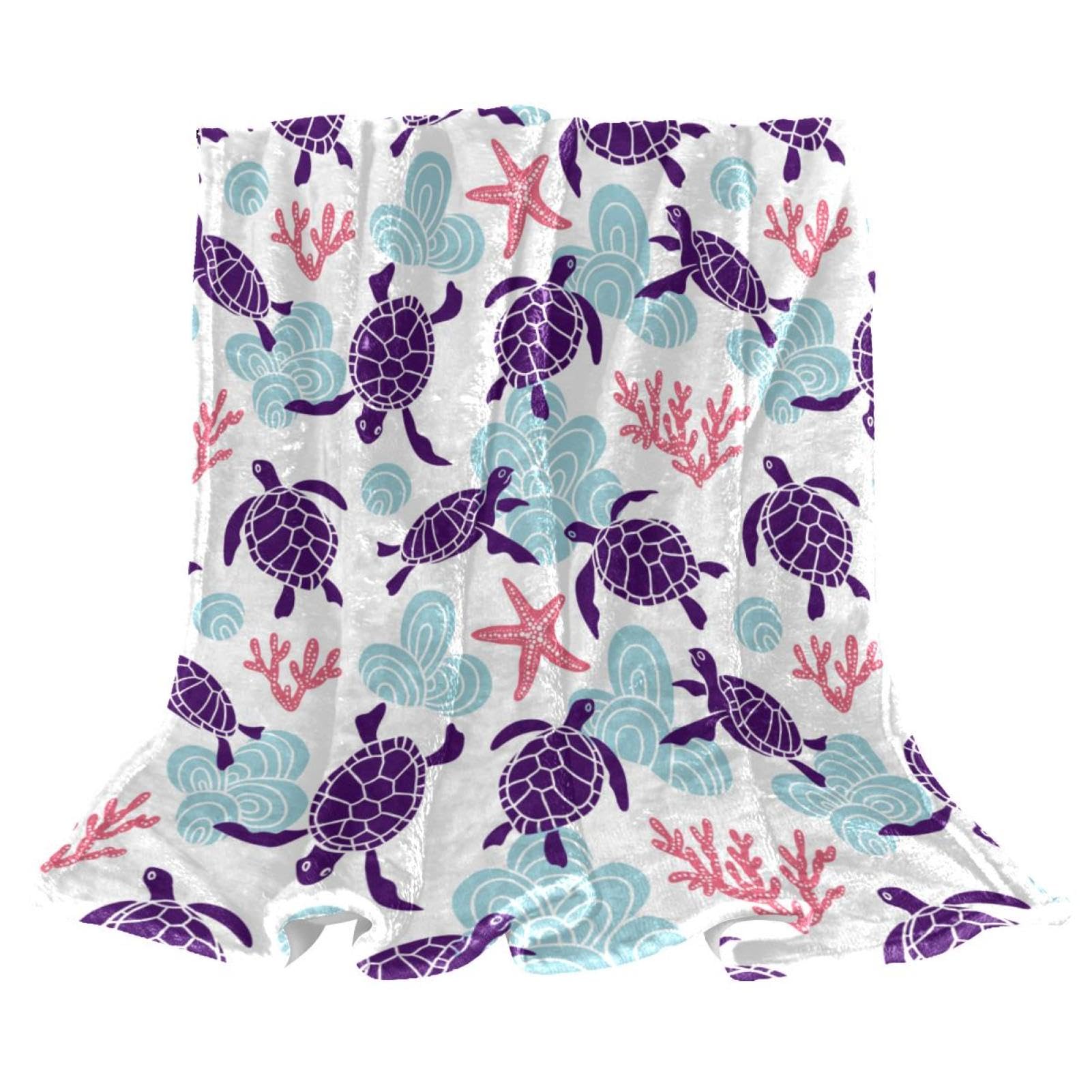 Couverture microfibre tortue pour cocooning au chaud sur le canapé du salon