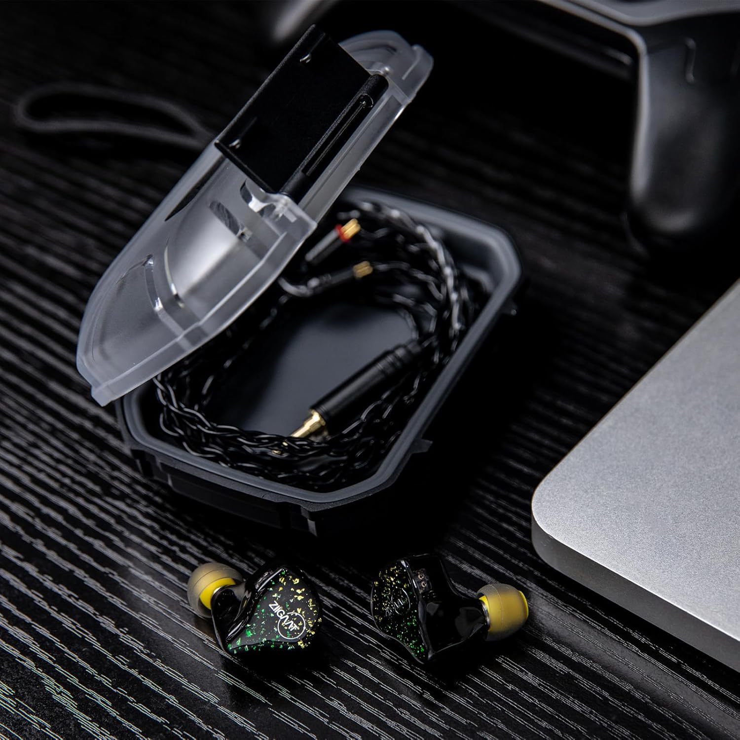 Open Linsoul LC02 case with in-ear monitors and cables stored inside.