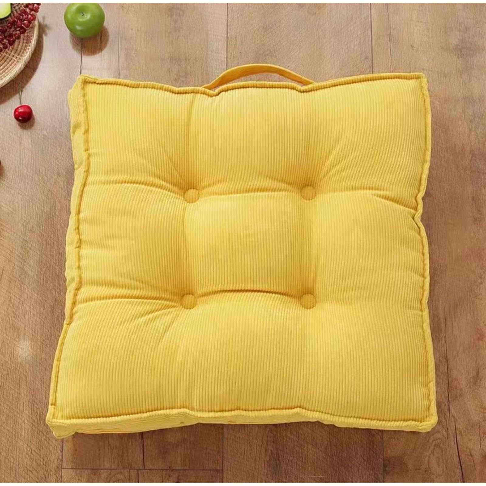 Coussin de sol épais contre les assises dures en velours jaune avec poignée