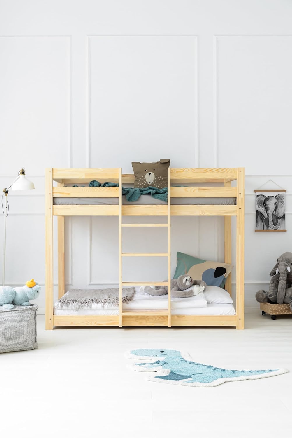 ADEKO CLPN 70x140 Wooden Bunk Bed in a child's room with bedding and toys