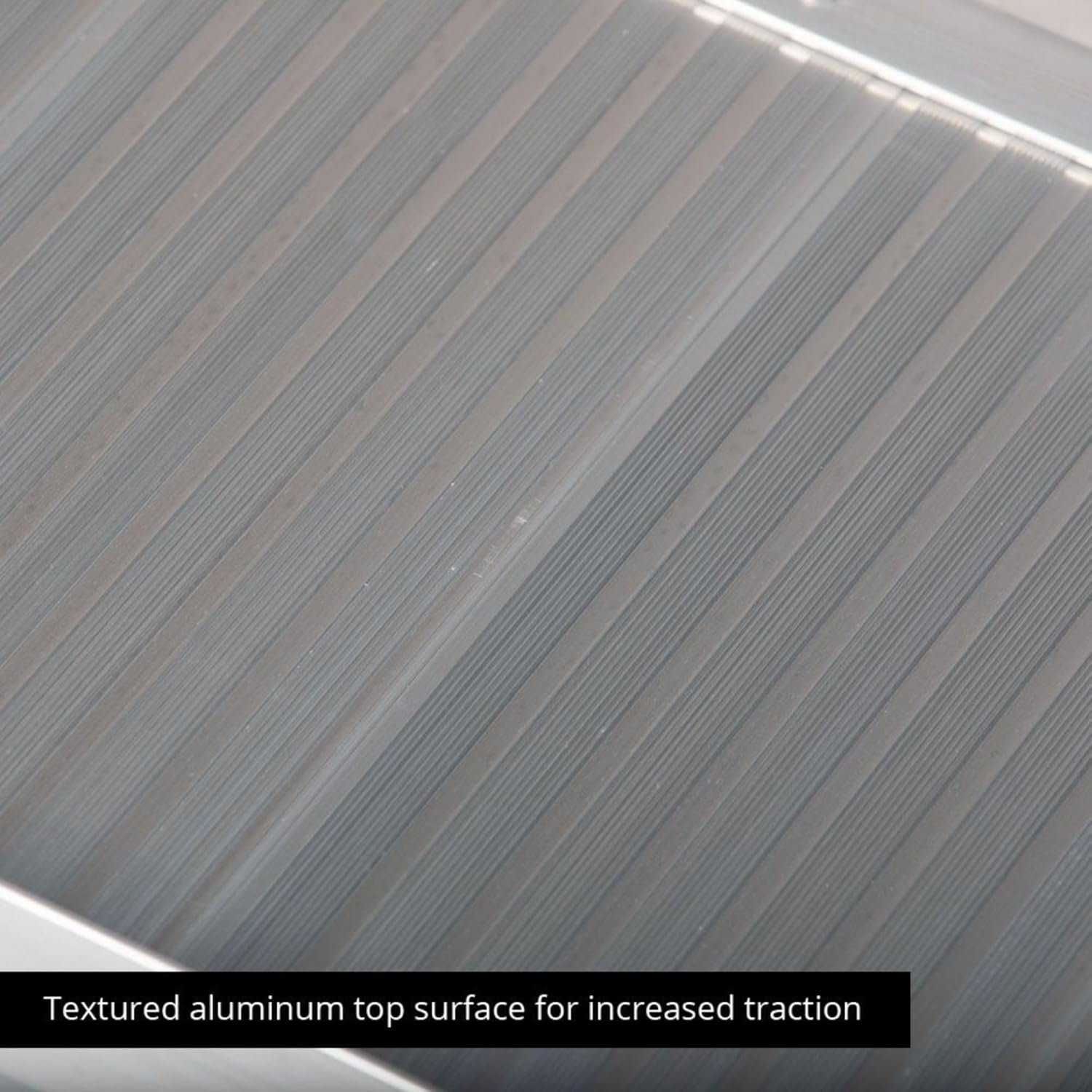 Close-up of the textured aluminum surface of the ramp.