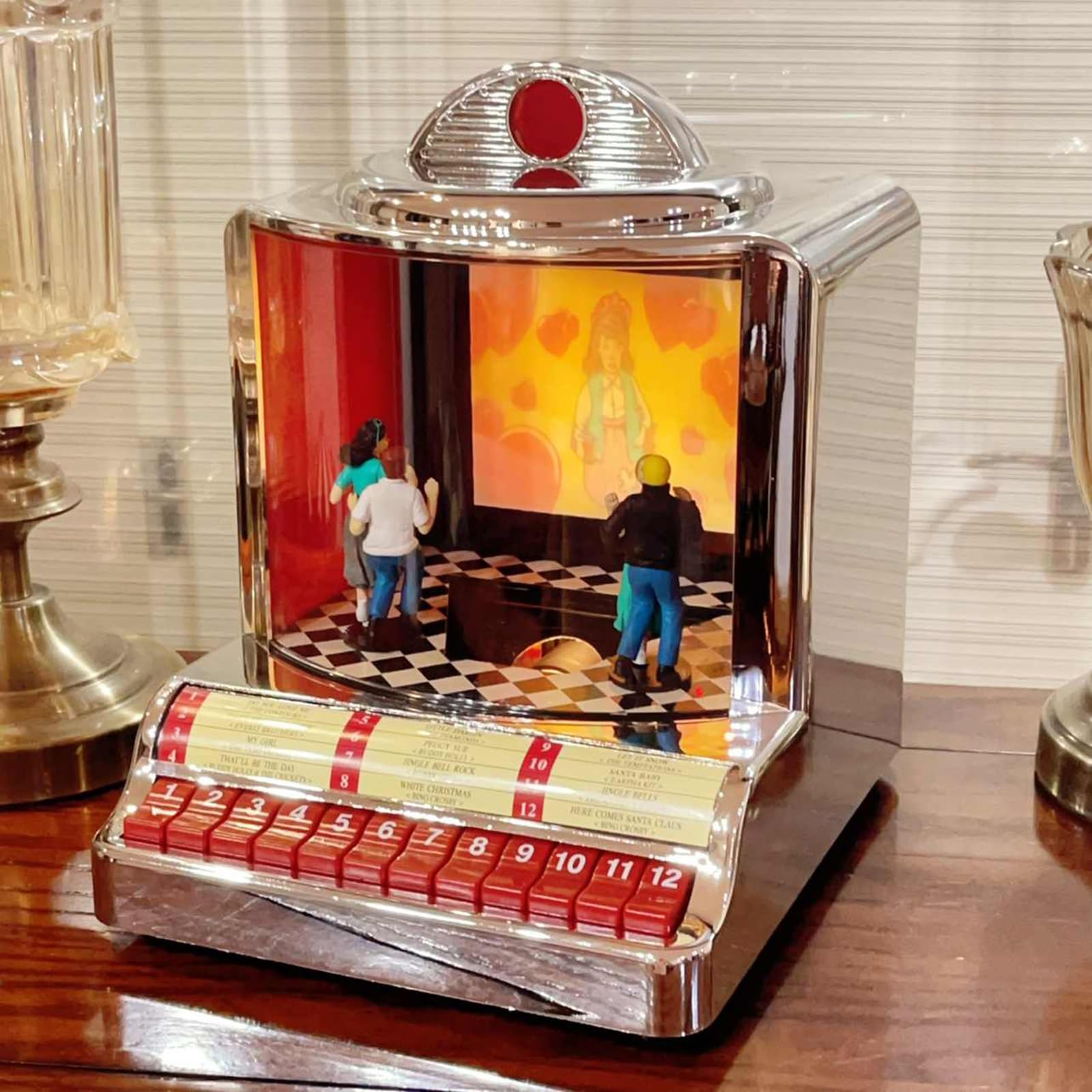 Jukebox retrò con altoparlante integrato e design classico anni '50, riproduce 12 canzoni con presentazioni sincronizzate