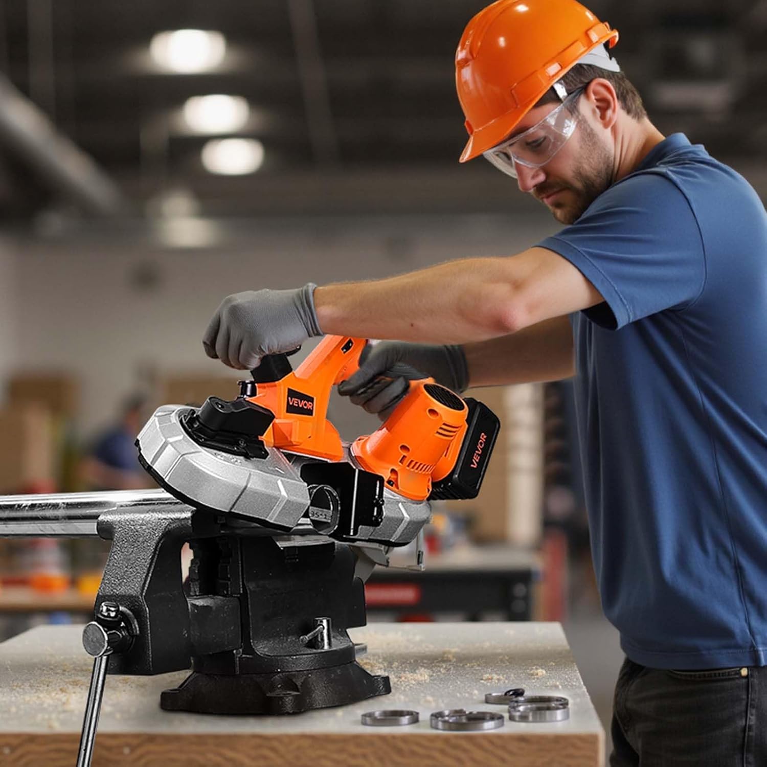 User operating the VEVOR band saw on a metal pipe secured in a vise