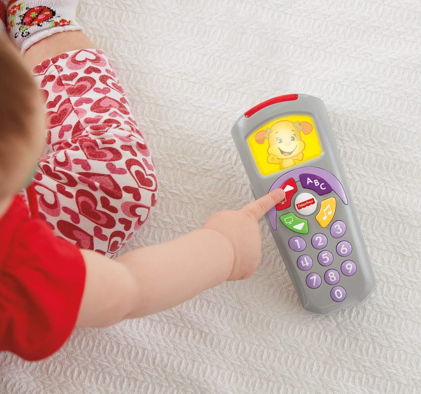 Fisher-Price Pretend TV Remote Baby Toy with Lights Music and Learning Songs, Fine Motor Toy, Toddler Pretend Play, Laugh & Learn Sis