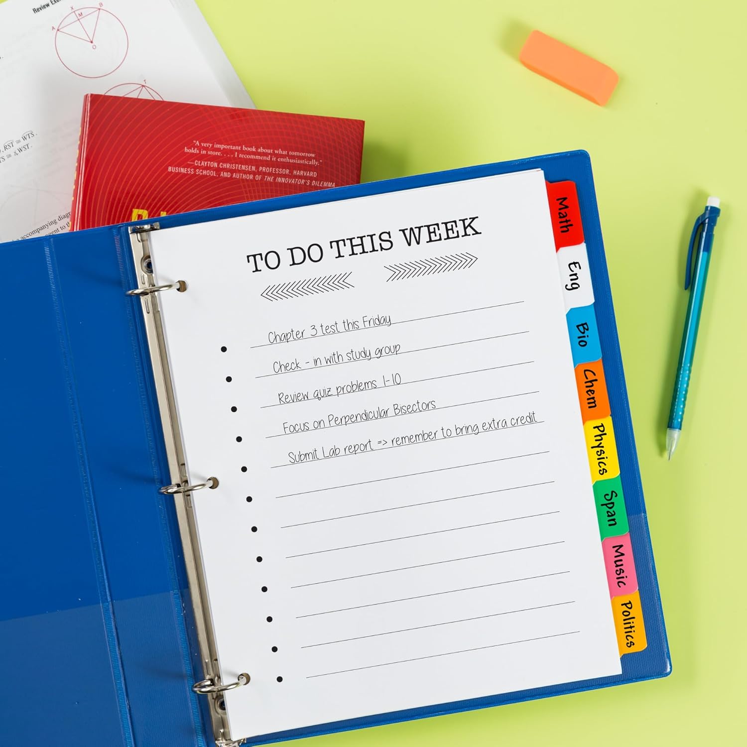 A blue 3-ring binder with Avery Big Tab dividers organizing school subjects