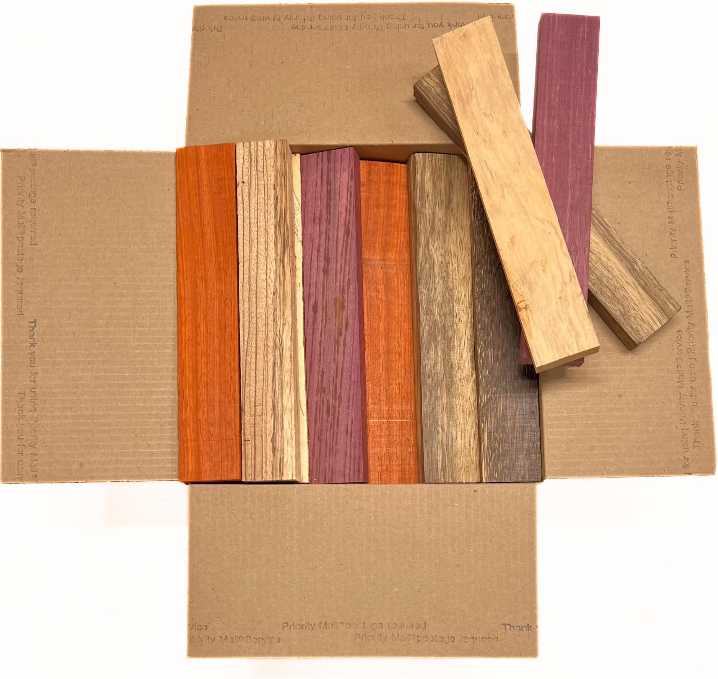 Exotic Wood Zone's Scarp Wood Cut Offs Box of Mixed Exotics (Purpleheart, Padauk, Black Palm, Bubinga, Tamarind and Black Limba) Wooden Scrap Craft Carving Scrolls Short Lumber Boards |