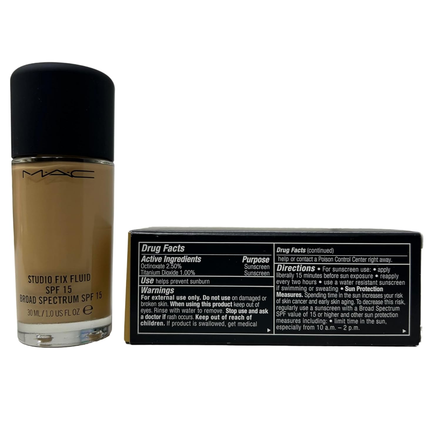 MAC Studio Fix Fluid bottle next to box showing drug facts and warnings