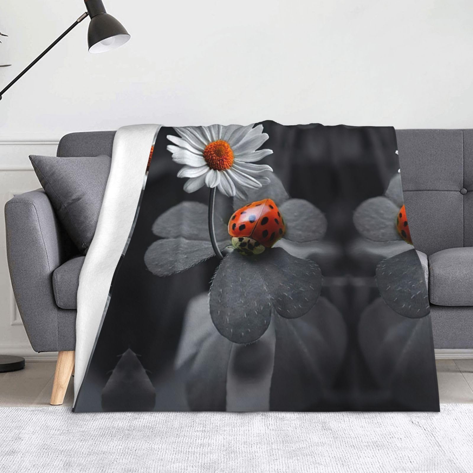 Couverture flanelle marguerites pour vos soirées cocooning au salon