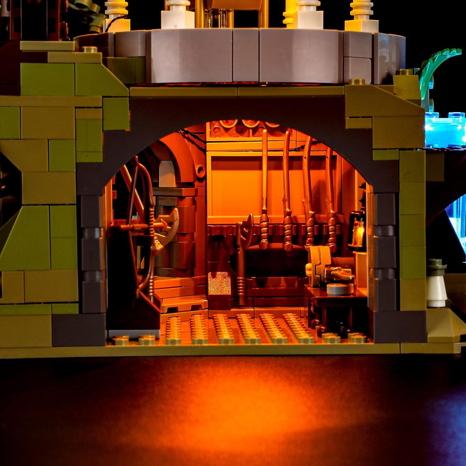 Close-up of an illuminated water feature with blue LED lights in the LEGO Rivendell model.