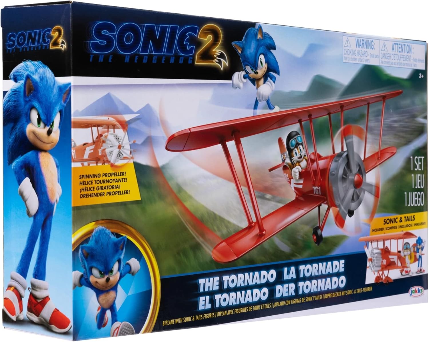 A child smiling and playing with The Tornado Playset, with Sonic on the wing and Tails in the cockpit.