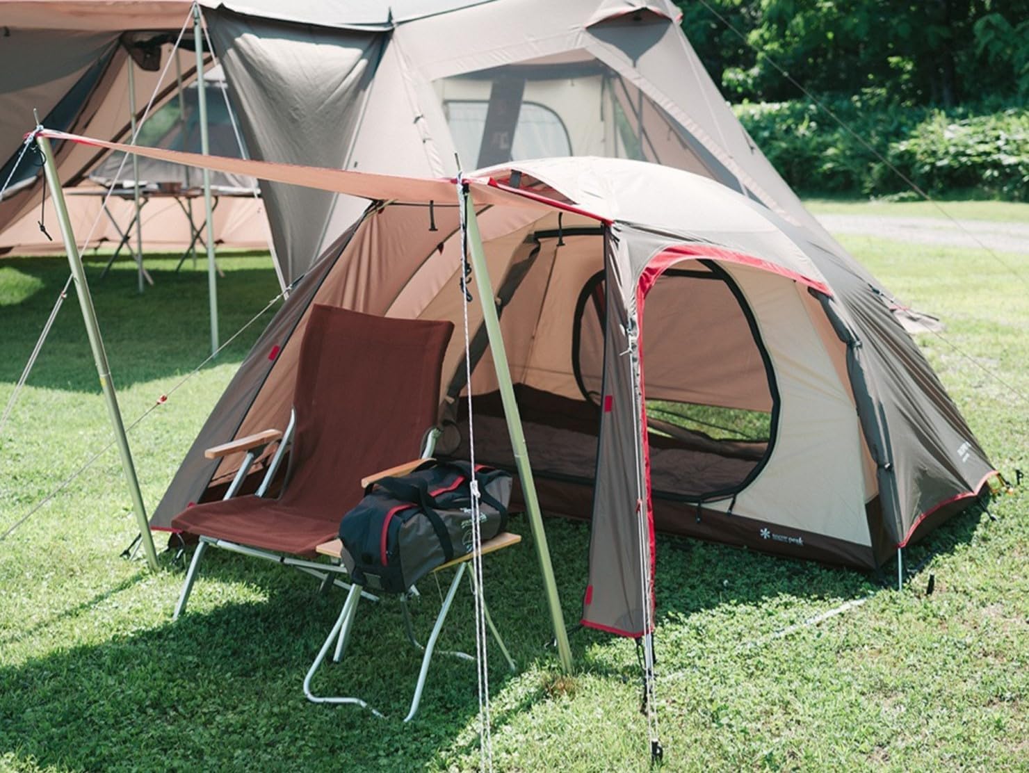 Snow Peak Trail Tripper Pro. 1 Tent in a camping setting with an additional tarp