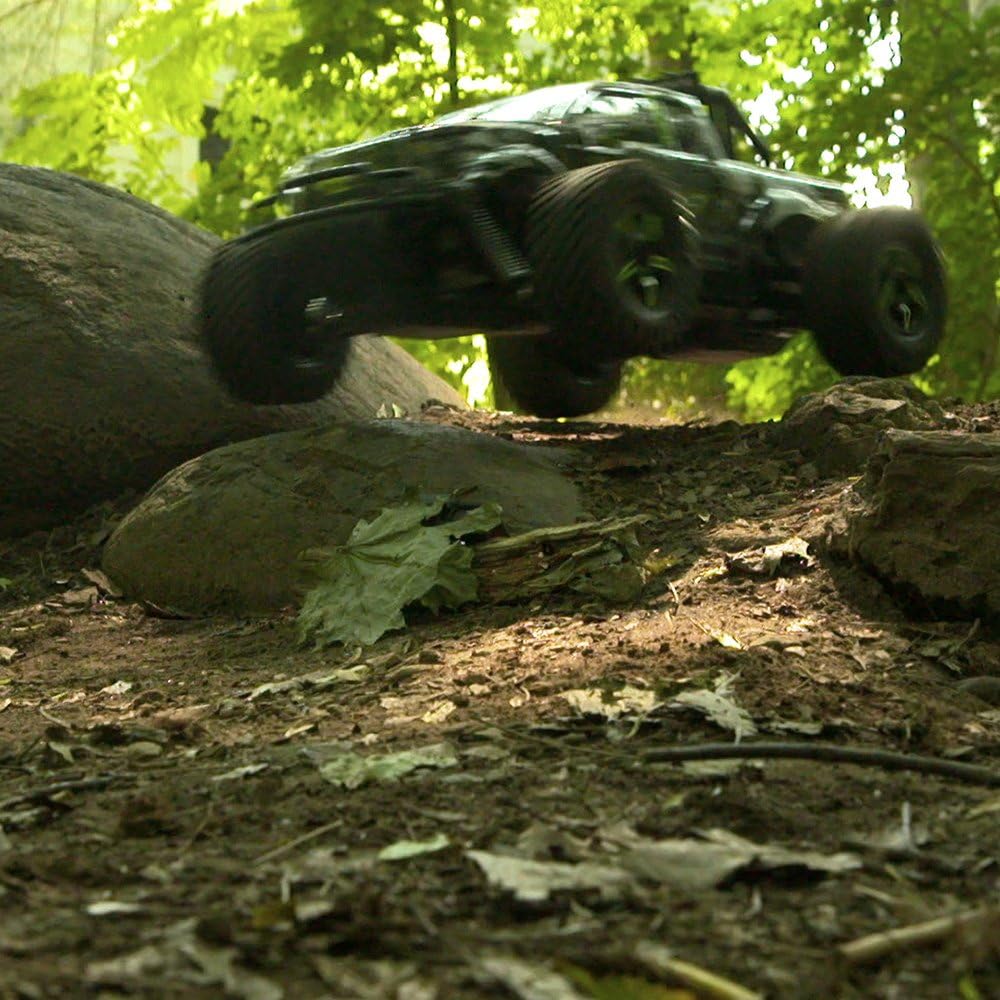 Kid Galaxy RC Truck jumping over a dirt mound