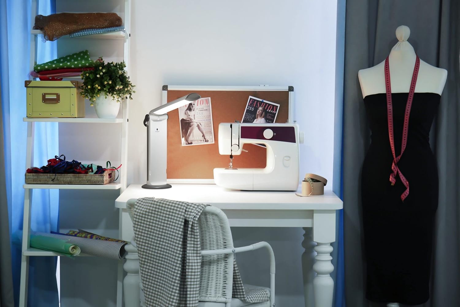 Crafting setup with sewing machine and daylight lamp