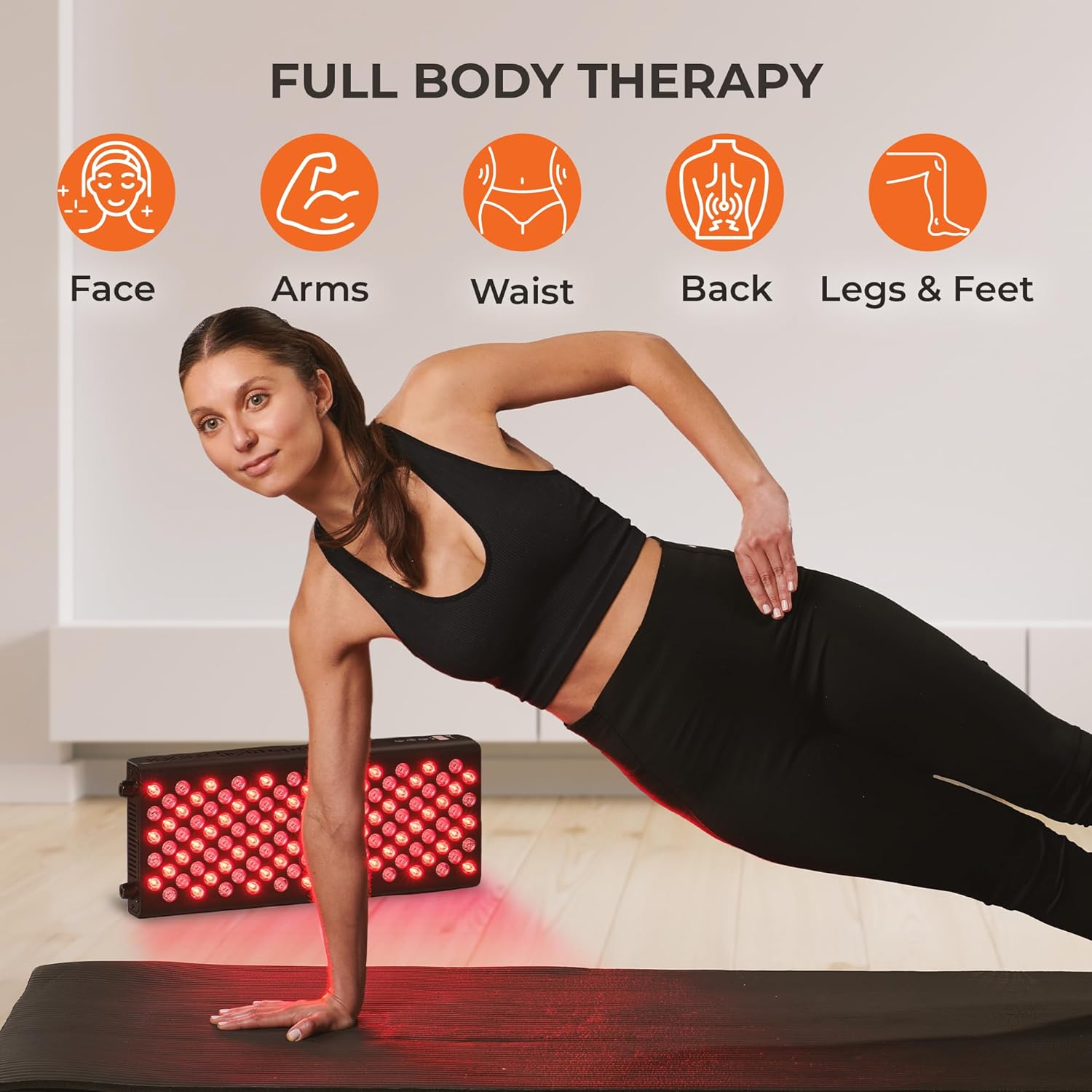 Woman doing a side plank exercise, demonstrating full body therapy with the red light panel
