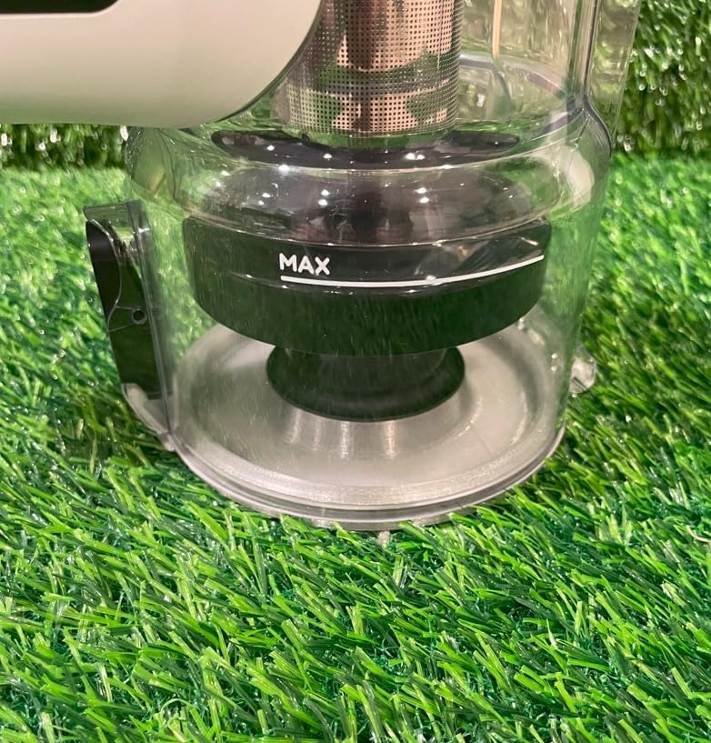 መቀራረብ view of the dust bin lid attached to the vacuum's dust bin, showing the 'MAX' fill line.