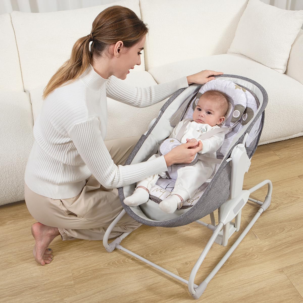Mother interacting with baby in Mastela 4-in-1 Bassinet Chair in resting chair mode