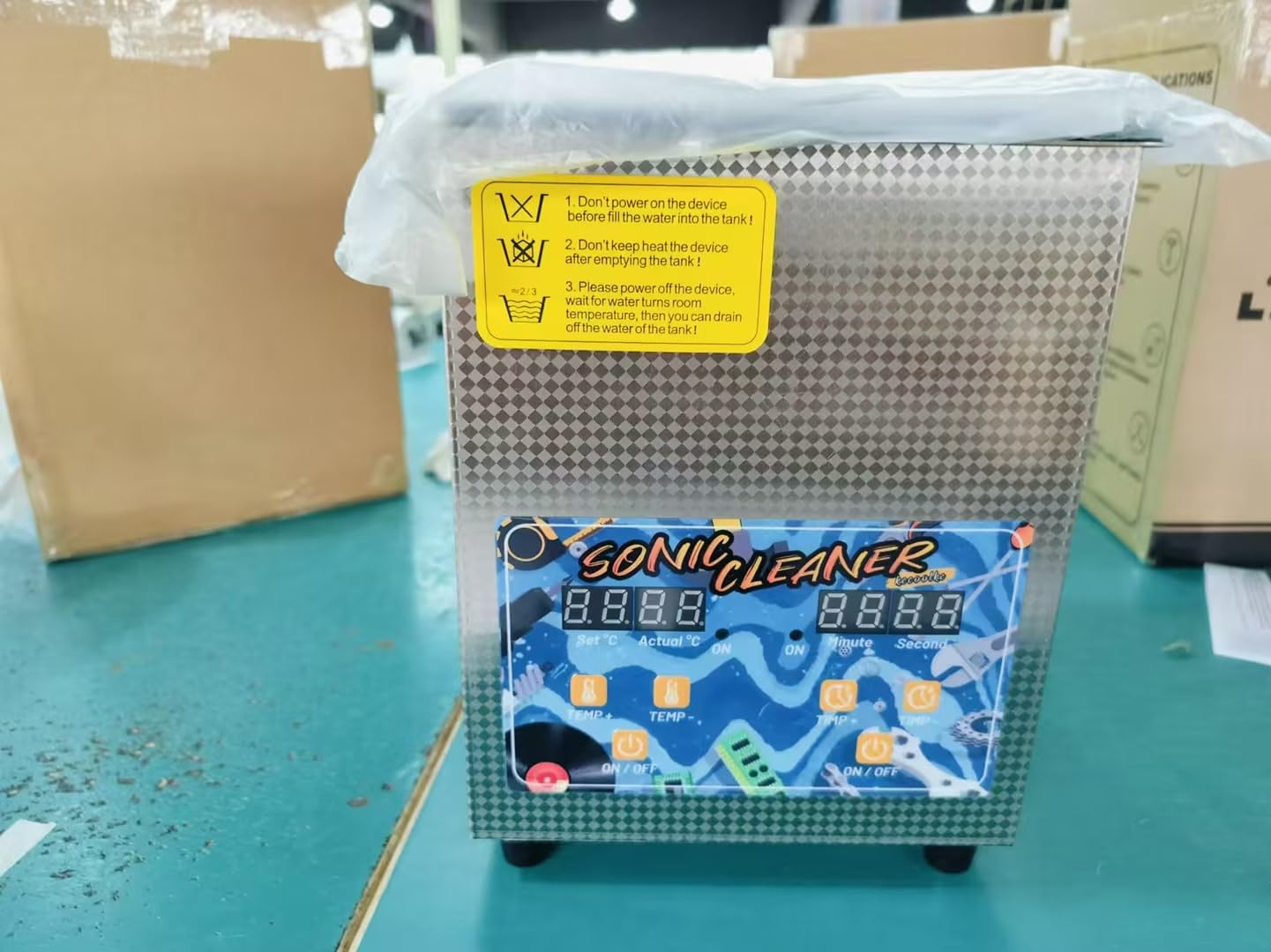 Warning labels on the KECOOLKE Sonic Cleaner