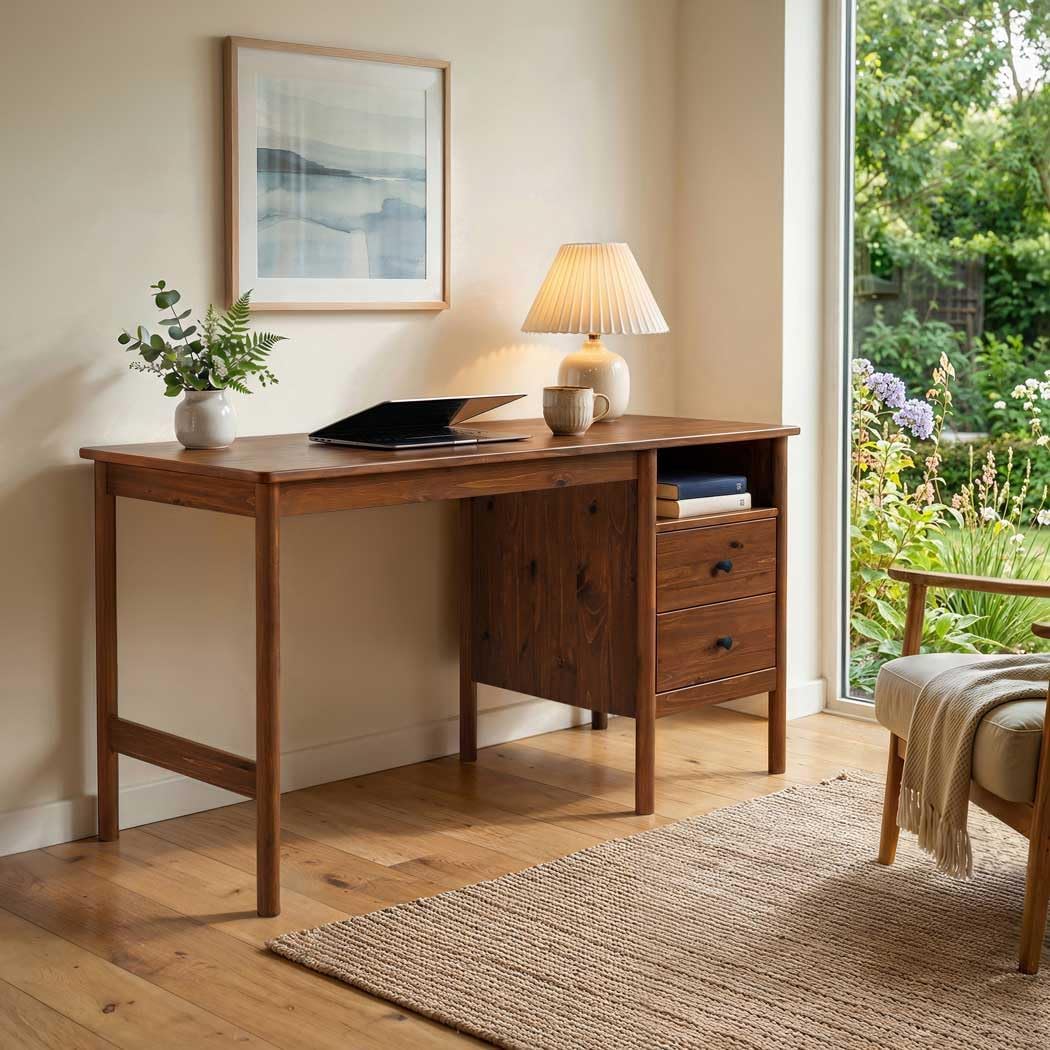 IDIMEX Bossa Home Office Desk in a room setting with a laptop, lamp, and plant.