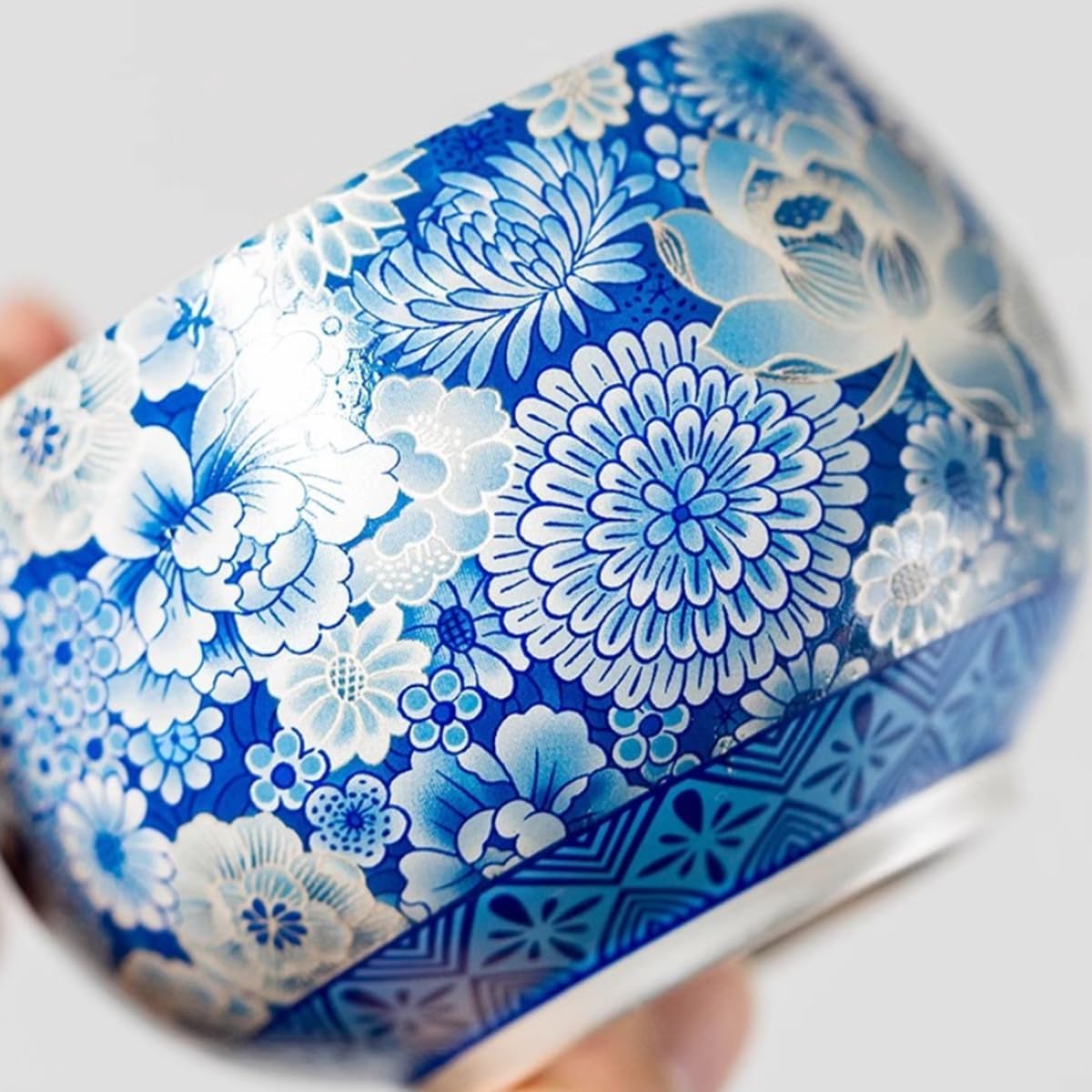 Handcrafted sterling silver teacup with intertwined lotus pattern, a high-end Chinese-style personal teacup/tea bowl, presented in a gift box packaging.