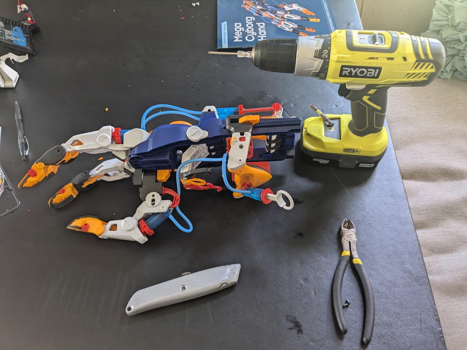 Close up of the Mega Cyborg Hand showing the hydraulic piston system that powers finger movement