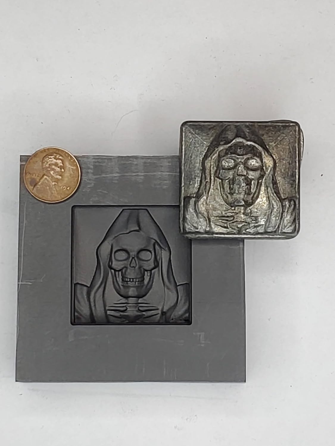 Graphite Mold Reaper Sq. This Mold is Ideal for Casting a 3D Image. Works Great with Gold, Silver, Copper, Aluminum, Tin, and Other Precious and Non-Precious Metals. As Well as Pressing Glass. Ingot