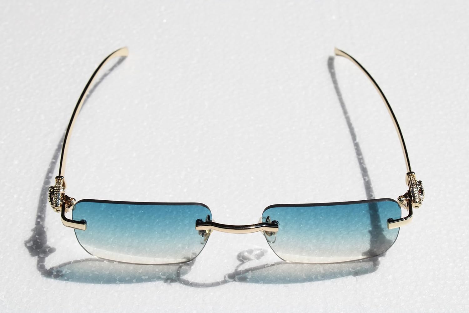 UM Gold Rimless Rectangle Sunglasses – Premium Frameless Design with Leopard Detail, High‑Clarity UV400 Lenses, Luxury Metal Temples