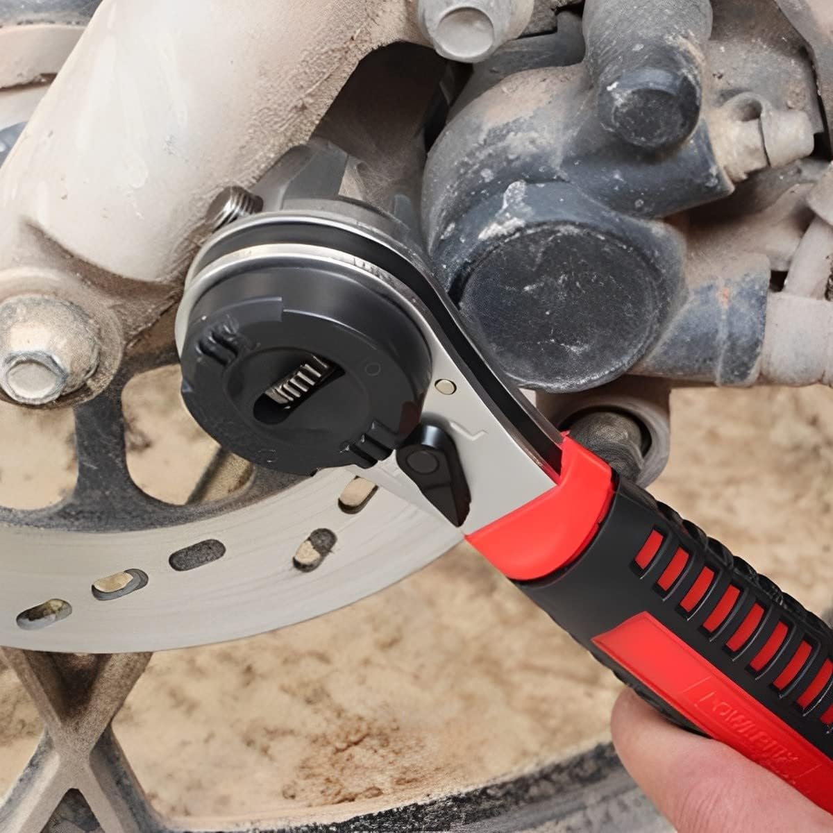 Ghopy Adjustable Ratchet Wrench being used on a vehicle's brake assembly.