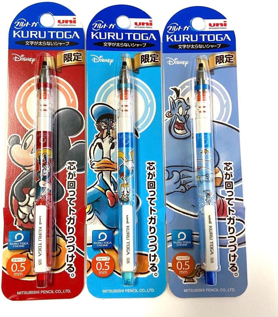 Set of three KURU TOGA mechanical pencils featuring classic character collaborations, displayed with white desk accessories on a dark background