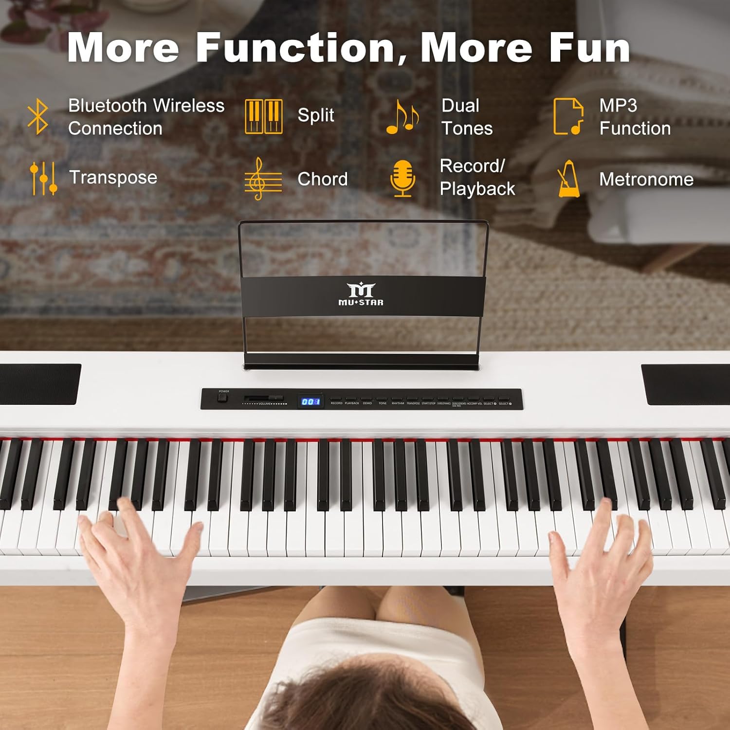 Top-down view of the digital piano with music rest and hands playing