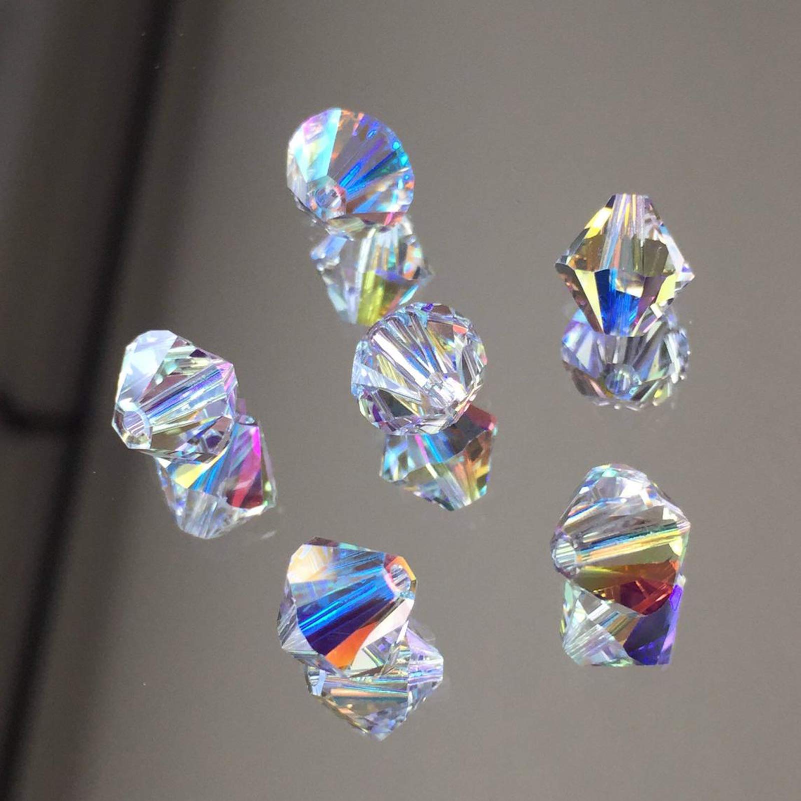 élange de perles en verre à facettes or et argent de 3 , 6 et 8 pour la confection de