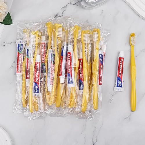 Cepillos de dientes desechables con pasta de dientes, paquete de 100, cepillo de dientes hueco amarillo con 0.35 onzas de pasta de dientes envueltos