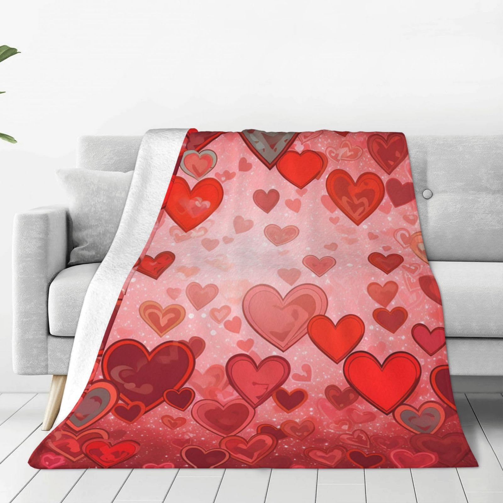 Couverture en micro polaire cœur idée cadeau idéal pour un salon cocooning