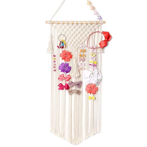 Macrame hair bow holder hanging on a bedroom wall with clips
