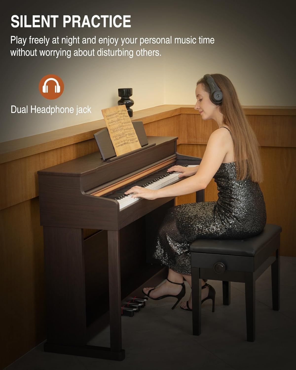 A person wearing headphones while playing the UISCOM UMP-200 digital piano, illustrating the silent practice feature with dual headphone jacks.