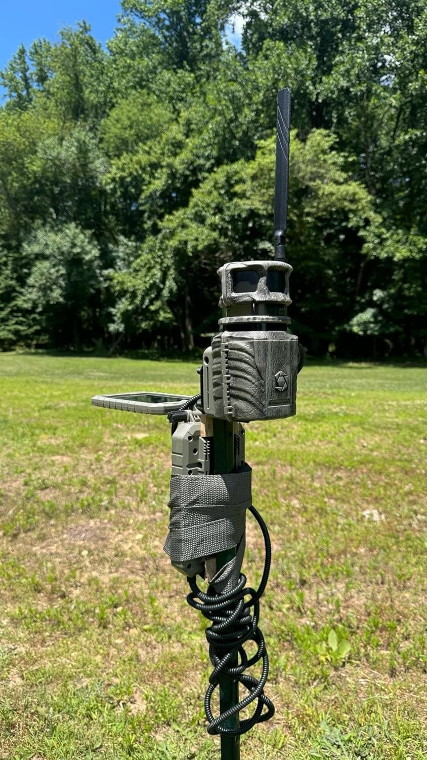 Stealth Cam Revolver mounted on a pole in an outdoor setting