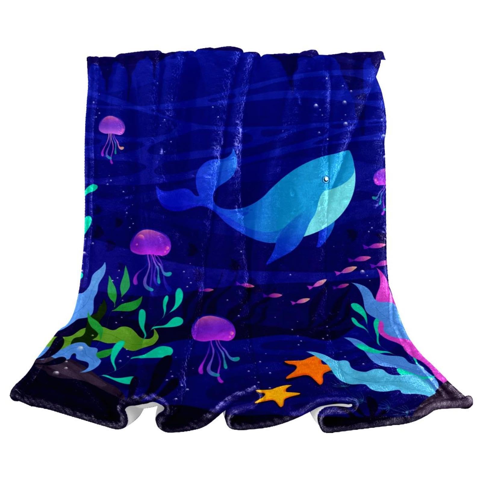 Couverture polaire baleine bleue pour des soirées cocooning douillettes sur le canapé