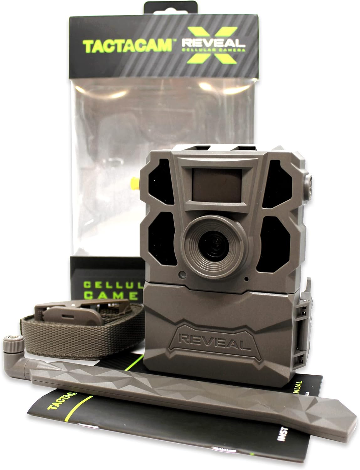 A person's hands securing a TACTACAM Reveal X Gen 2.0 camera to a tree trunk using a mounting strap, demonstrating the installation process.