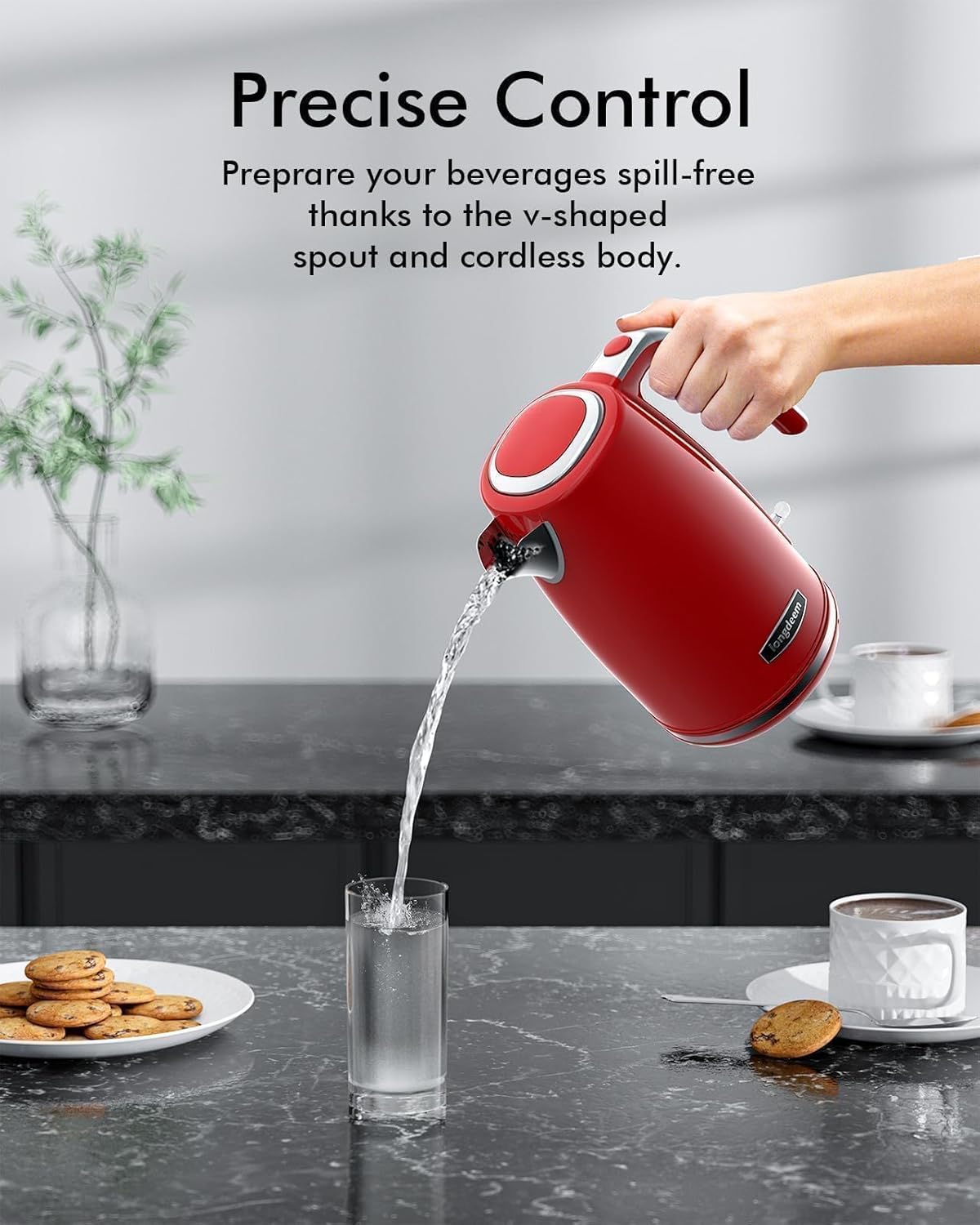 Hand pouring water from LONGDEEM kettle into a glass