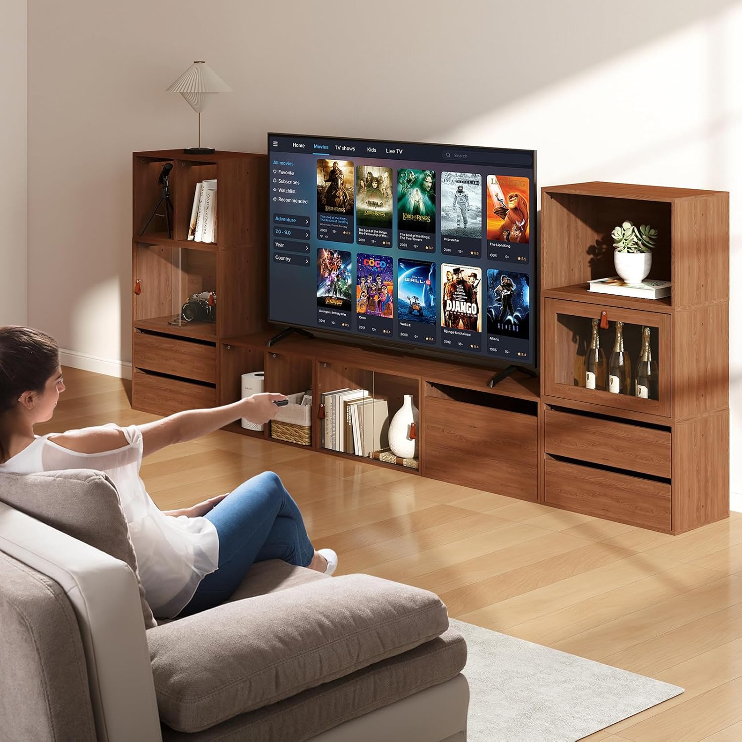 Person watching TV with the modular TV stand in a living room